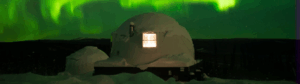 Igloo lodging with aurora overhead